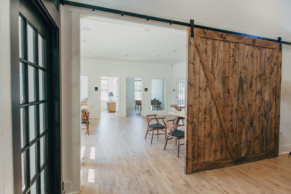 large reclaimed barn door in modern home